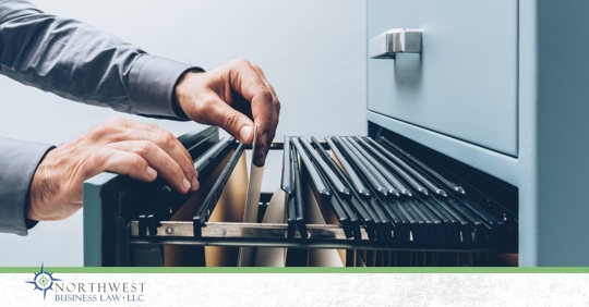 Man hands looking through files